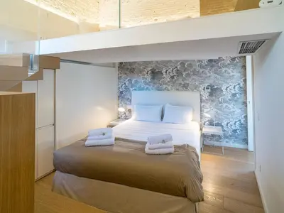 a bedroom with a bed with two towels on it at LUXURY Terrazza Privata su Fontana di Trevi in Rome