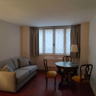 a living room with a couch and a table at Discover the Pantheon from The Berardi Studio Flat in Rome
