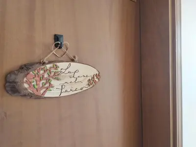a plate hanging on a wall next to a door at La Casa nel Parco - Stadio Olimpico, Auditorium con posto auto in Rome