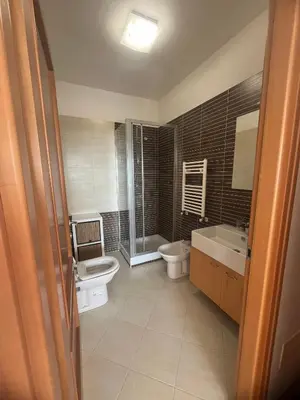 a bathroom with a toilet and a sink at Mi Casa Es Tu Casa Roma in Rome