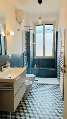 a bathroom with a tub and a toilet and a sink at Casa Duci in Rome