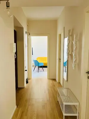 a hallway with a table and a chair in a room at Casa Duci in Rome