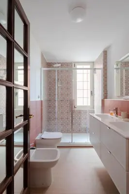 a bathroom with a toilet and a sink and a shower at Nuovo appartamento a S. Lorenzo con 3 camere in Rome