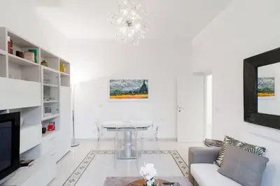 a living room with a couch and a table at Brightful Boutique Apartment in the Heart of Trastevere in Rome