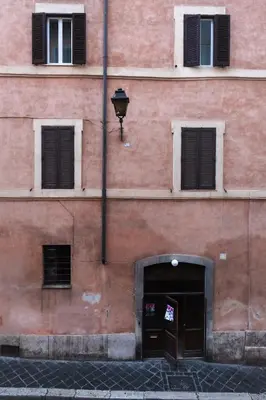 a pink building with a door and a window at Modern pied a terre near Piazza Navona in Rome