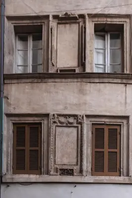 an old building with windows on the side of it at Modern pied a terre near Piazza Navona in Rome