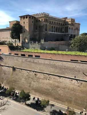 a large building with people walking in front of it at MUSEUM DAY VATICAN in Rome