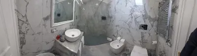 a white bathroom with a sink and a toilet at Piazza Navona - Penthouse in the heart of Rome in Rome