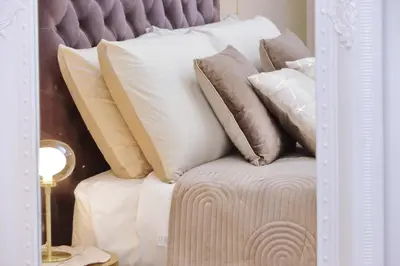 a pile of pillows sitting on top of a bed at Amazing penthouse in the heart of Rome in Rome