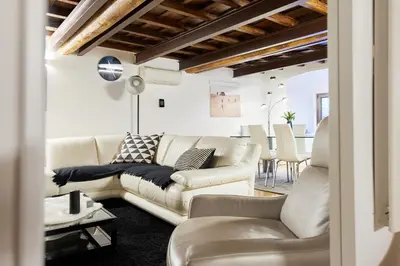 a living room with a couch and a table at iFlat Marvellous home near Via del Corso in Rome