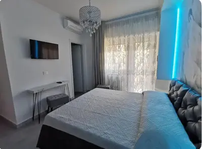 a bedroom with a bed and a tv and a window at Dulcis in Fundo in Rome