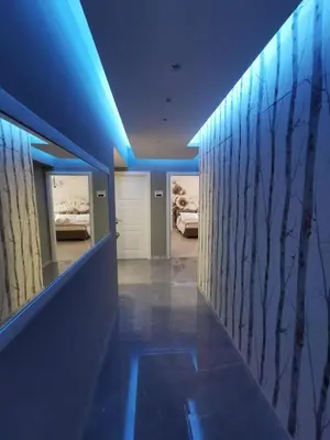 a hallway with blue lights in a room with beds at Dulcis in Fundo in Rome