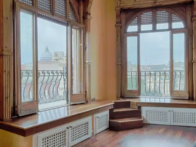 a room with large windows and a view of the city at Apartment Le Colonne by Interhome in Rome