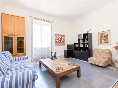 a living room with a couch and a coffee table at Apartment Angelico by Interhome in Rome