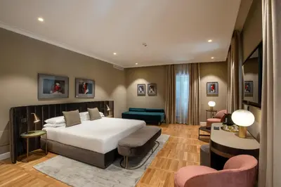 a bedroom with a bed and a living room at Condotti Belvedere in Rome