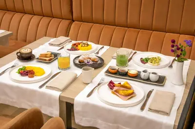 a table with plates of breakfast food on it at Condotti Belvedere in Rome