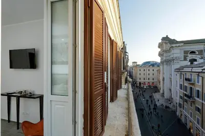 a view of a city street from a building at Boutique Suites della Croce in Rome