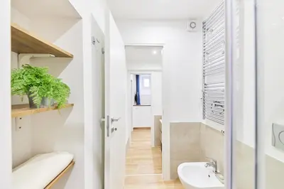 a bathroom with a toilet and a sink at iFlat Lovely Modern Apartment in Rome