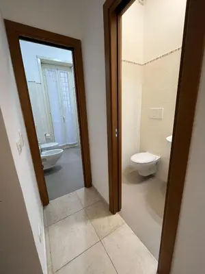 a bathroom with a toilet and a sink at Monti Deluxe Apartment in Rome
