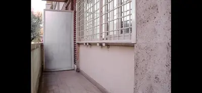 an empty hallway with a white door in a building at Monti Deluxe Apartment in Rome