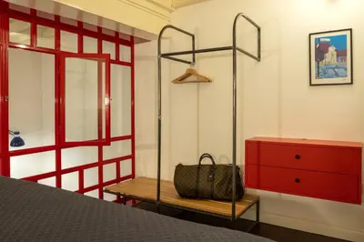a bedroom with a bed and a red dresser at Farina 36 in Rome