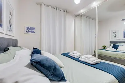 a bedroom with two beds with towels on them at BDC - The Platinum 2-Bdr apt @Spanish Steps in Rome