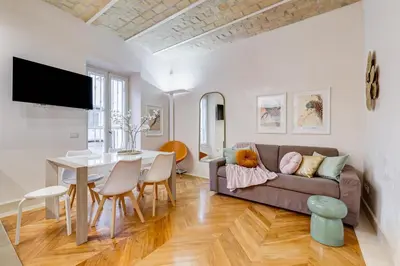 a living room with a couch and a table at BDC - The Platinum 2-Bdr apt @Spanish Steps in Rome