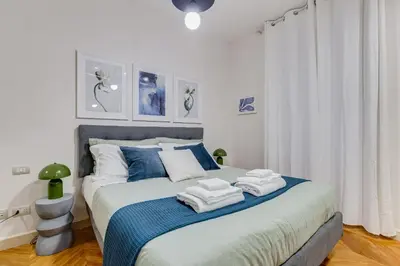 a bedroom with a bed with towels on it at BDC - The Platinum 2-Bdr apt @Spanish Steps in Rome