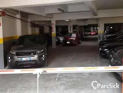 a parking garage with several cars parked in it at Domus Iulius in Rome
