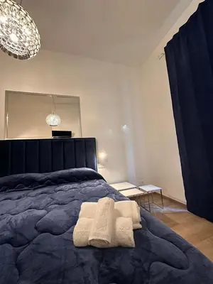 a bedroom with a bed with two towels on it at Domus Iulius in Rome