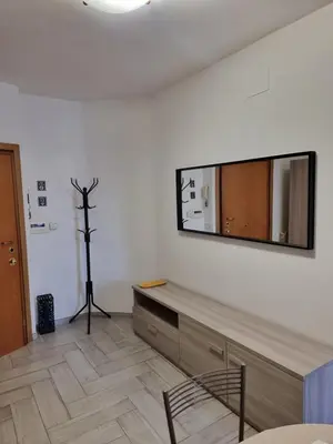 a living room with a mirror on the wall at Loftiense Roma in Rome