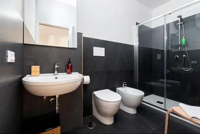 a bathroom with a sink and a toilet and a shower at Roma Mia in Trastevere in Rome