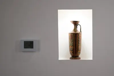 a vase sitting on a shelf next to a lightswitch at PgrHome Boschetto in Rome