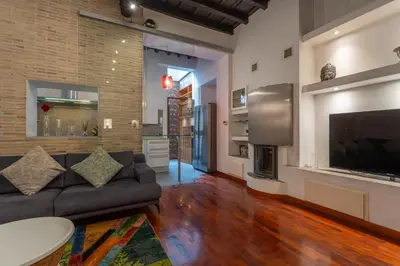 a living room with a couch and a tv at PgrHome Boschetto in Rome