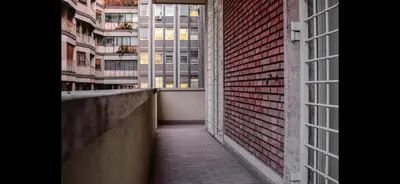 an empty hallway in a building with tall buildings at Monti Exclusive Apartment in Rome