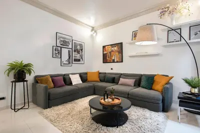 a living room with a couch and a table at Angelique Boutique in Rome