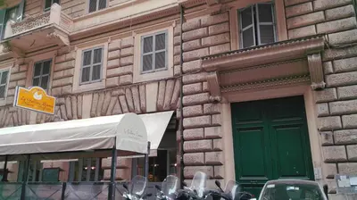 a group of motorcycles parked in front of a building at Casa Vacanza Colosseo in Rome