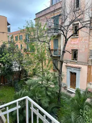 a staircase leading up to a building with palm trees at Volupta's House Janiculum Hill in Rome