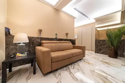a living room with a couch and a table at 50 Gandino Deluxe in Rome