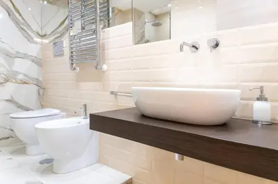 a bathroom with a sink and a toilet at 50 Gandino Deluxe in Rome
