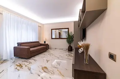 a living room with a couch and a table at 42 Gandino Superior in Rome