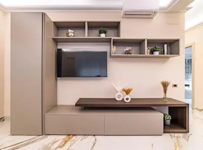 a living room with a tv on a wall at 42 Gandino Superior in Rome