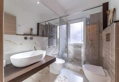 a bathroom with a tub and a toilet and a sink at 42 Gandino Superior in Rome