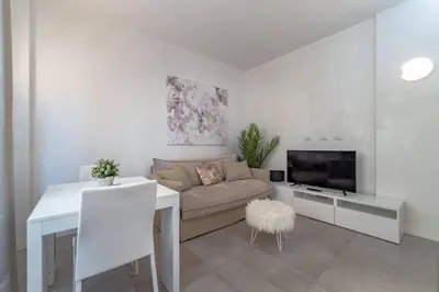 a living room with a couch and a table at 35 Gozzadini in Rome