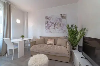 a living room with a couch and a table at 35 Gozzadini in Rome