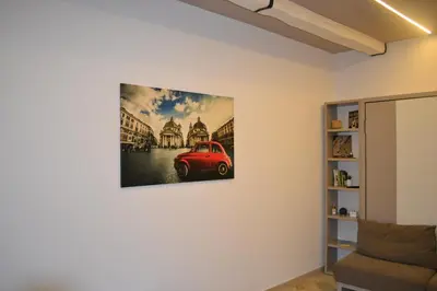 a hallway leading to a bathroom with a radiator at AlVin Casa in Rome