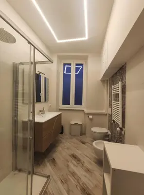 a bathroom with a shower and a sink and a toilet at AlVin Casa in Rome