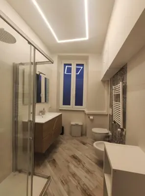 a bathroom with a toilet and a sink and a shower at AlVin Casa in Rome