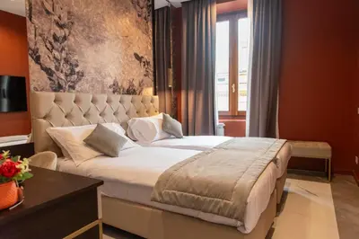a bedroom with a large bed in a room at Adelaide Suite Dreams in Rome