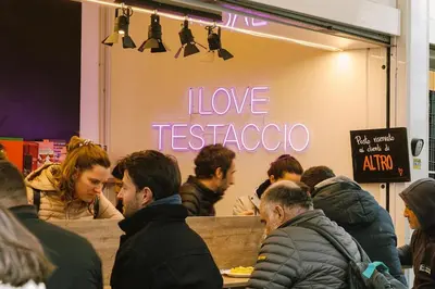 a pair of yellow gloves holding a piece of paper at Bob W Rome Testaccio in Rome